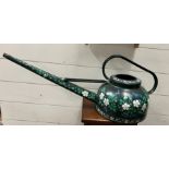 A hand painted watering can