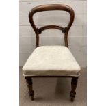 A mahogany upholstered dining chair