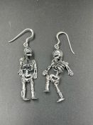 A pair of silver skeleton earrings