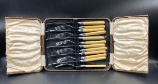 A bone handled set of fish knives and forks