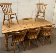 A pine farmhouse table with six chairs (H79cm W215cm D91cm)