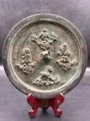 An antique Chinese bronze mirror possibly Tang Dynast (approx. Dia4.5cm)