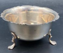 A three legged silver sugar bowl by Thomas Hayes, hallmarked for Birmingham 1901.