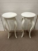 A pair of white wooden side tables