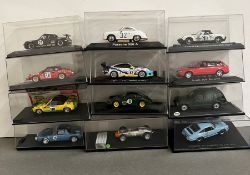 Twelve boxed Rally and Racing diecast vehicles, various years.
