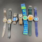 A selection of seven vintage Swatch watches, various designs.