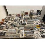 A large selection of motor memorabilia including badges, mini door handles, winders, Morris 8