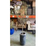 A black painted metal plant stand (H128cm)