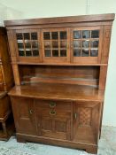 An oak buffet with Art Nouveau characteristics, bevelled glass panelled display cabinet stood on