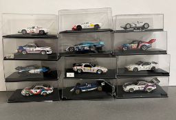 Twelve boxed Rally and Racing diecast vehicles