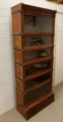 A rare eight section Globe Wernicke bookcase with moulded cornice top, six glazed sections, brass