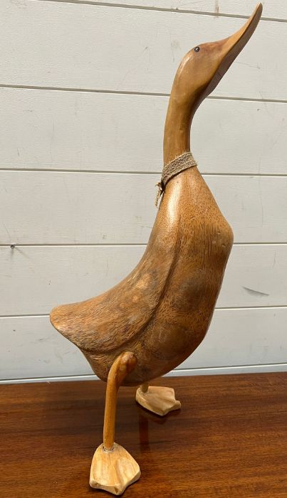 A carved wooden decorative duck