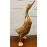 A carved wooden decorative duck