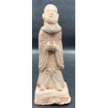 An Antique Chinese terracotta figure, marked to base