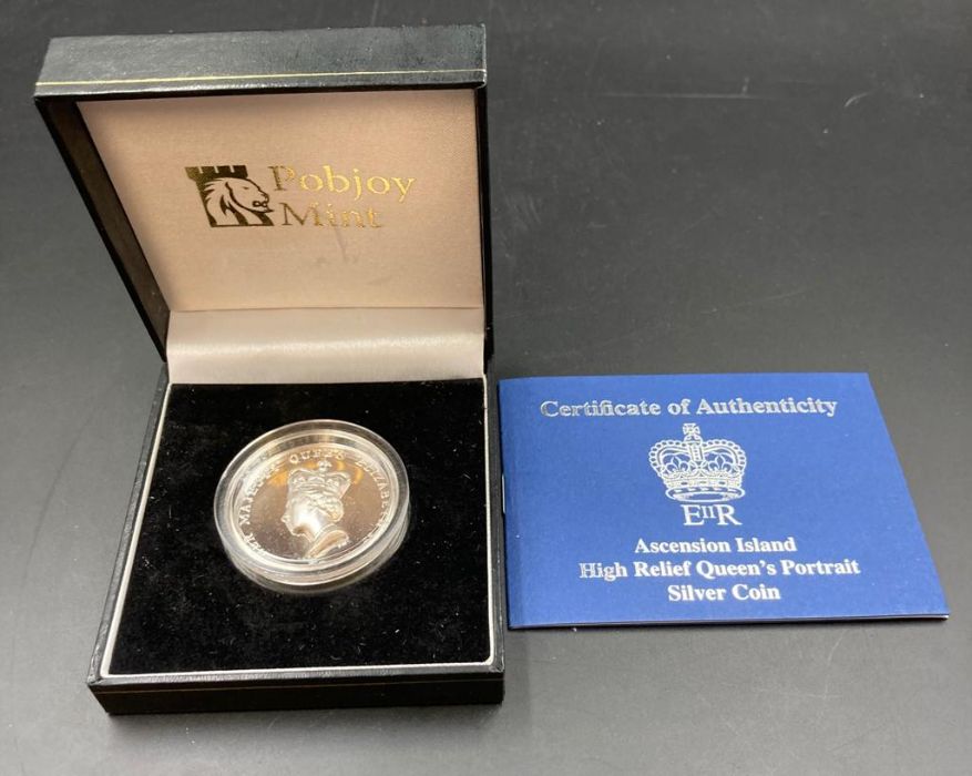 A Pobjoy Mint Elizabeth II Ascension Island £5 silver proof coin with Queens Head in relief.