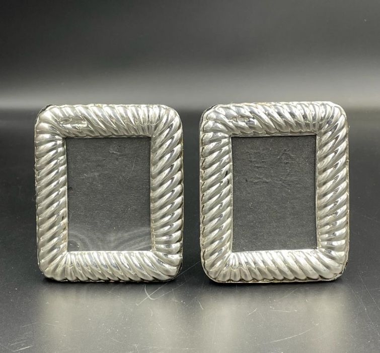 A Pair of miniature silver photo frames (Approx 8cm x 7cm)