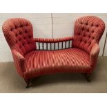 A Victorian double ended Serpentine conversation seat or love seat with deep button back and