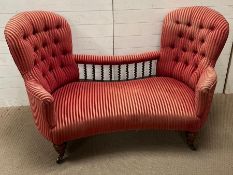 A Victorian double ended Serpentine conversation seat or love seat with deep button back and