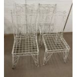 A Wrought Iron scrolling weathered table with Four vintage matching chairs both with hair pin legs