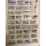 Four albums of world stamps, various countries and ages