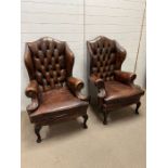 A Pair of Wing Back Library Chesterfield Arm Chairs