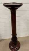 A mahogany lamp/plant stand (H102cm Dia27cm)