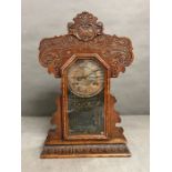 An oak cased gingerbread clock