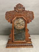 An oak cased gingerbread clock