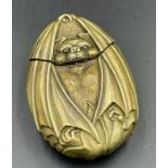 A brass vesta in the form of a bat