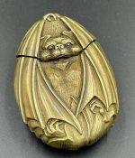 A brass vesta in the form of a bat