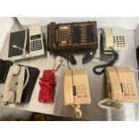 Five press button phones, one intercom and others