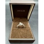 A 1.5ct diamond ring with diamond shoulders, set in 14ct white gold Size L