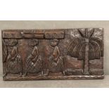 A carved wooden African wall hanging (61cm x 31cm)