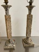 A pair of column textured lamps with marble tops