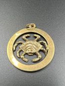 A 9ct gold Cancer pendant (Approximate Weight 2.3g)