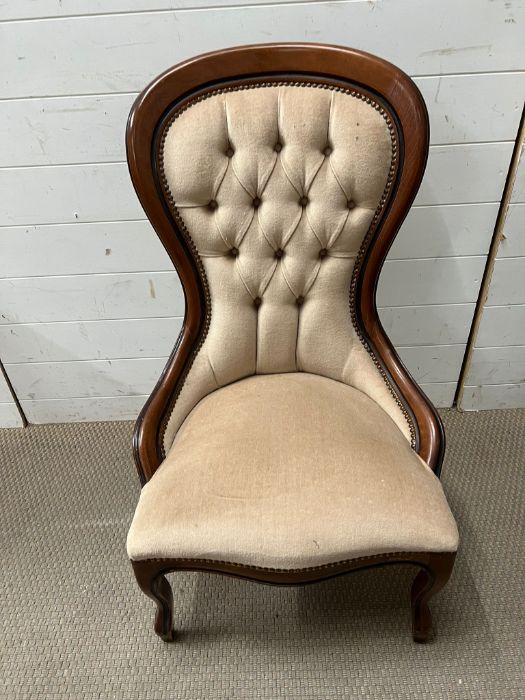 A Victorian style nursing chair with button back