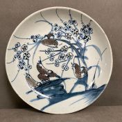 A Chinese Qing Jiaqing blue and white plate with birds in copper red (Dia23.5cm)