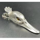 A silver plated duck letter clip with glass inset eyes