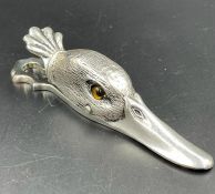 A silver plated duck letter clip with glass inset eyes