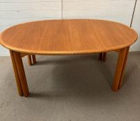 A Mid Century teak dining table, extending to a total length 376cm with four leaves (48cm each leaf)