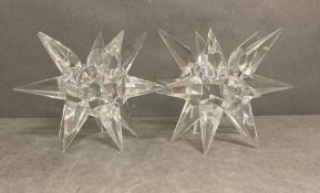A pair of glass starburst Julien Macdonald candle holders