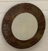 A Circular copper framed mirror Arts and Crafts style 59 cm in diameter