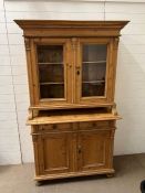 A pine dresser with glaze top unit and two door cupboard under (H193cm W110cm D49cm)