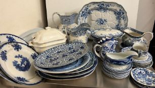 A mixed selection of blue and white china to include jugs, plates and meat platters