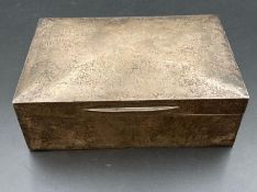 A silver cigarette box, indistinct hallmarks but engraved for 1921.