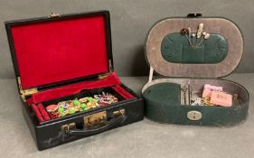 Two jewellery boxes with assorted costume jewellery.