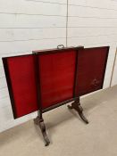 A mahogany fire screen