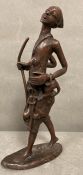 A bronze figure of an African shepherd