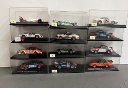 Twelve Boxed Rally and Racing diecast cars by Mini Champs, Universal Hobbies and other markers