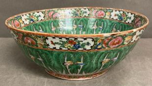 A Chinese porcelain Famile Verte cabbage and butterfly pattern bowl